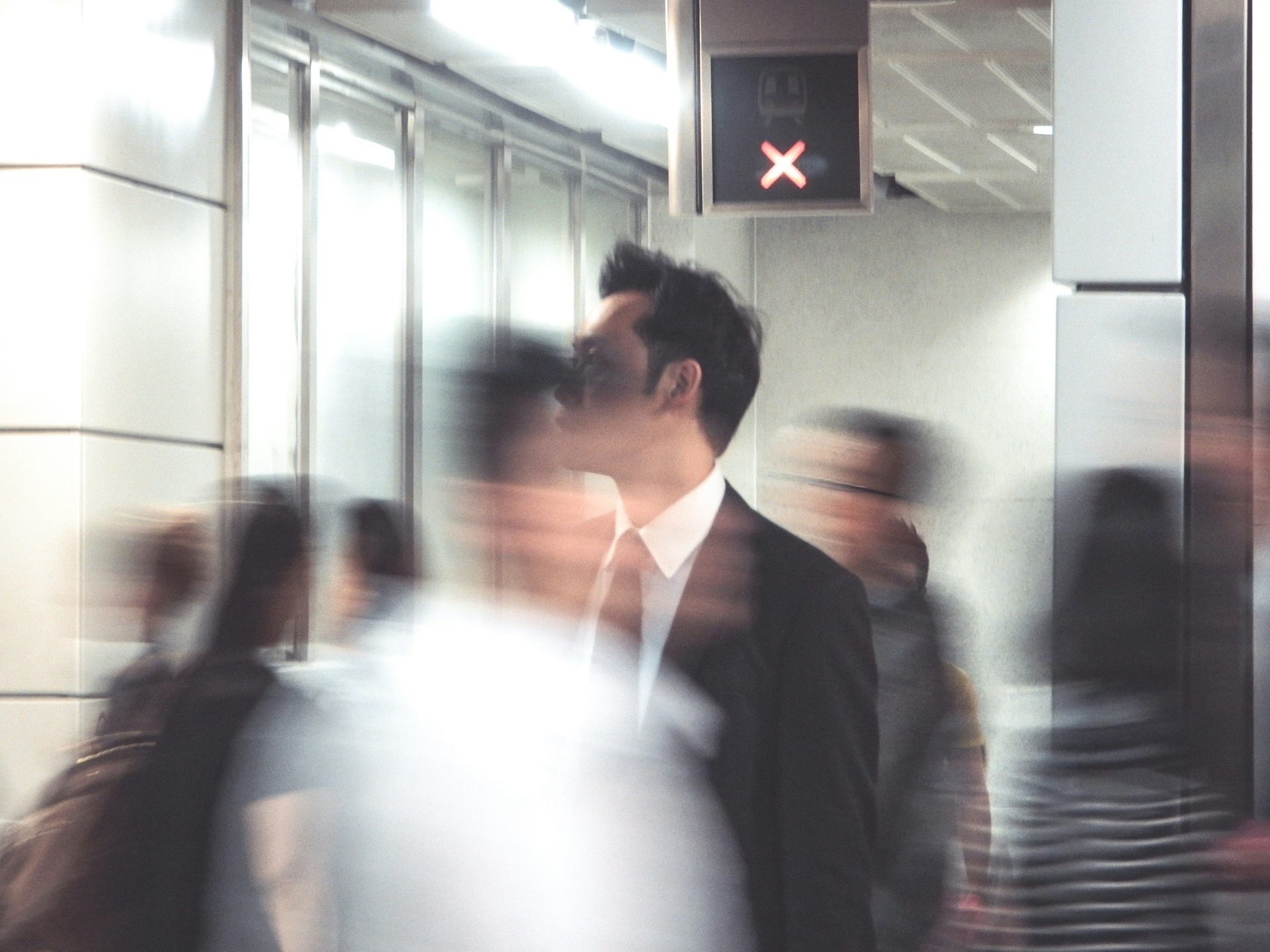 Travellers moving through a Nordic transit hall